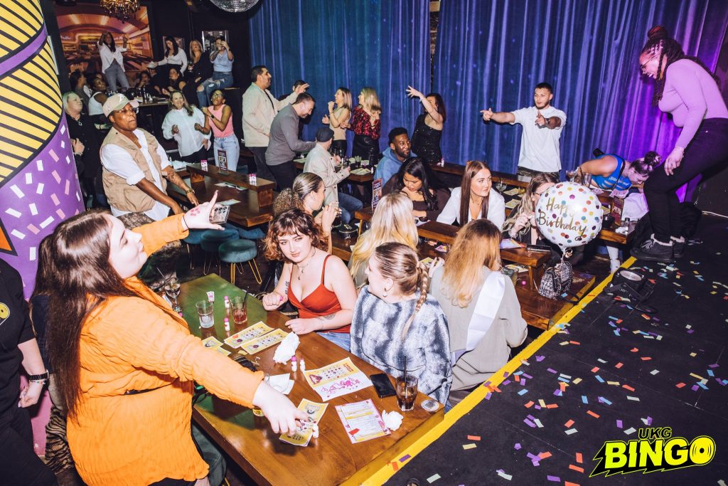 Bingo crowd enjoying the game
UKG Bingo event atmosphere
Excited participants marking bingo cards
Colorful bingo card close-up
Grand prize announcement moment
Voucher prize showcase
Flight ticket prize display
Music vinyl prize collection
Unique party gifts for winners
UKG Bingo logo and branding
Happy winner celebrating victory
Event host or DJ entertaining the crowd
High-energy crowd shot at UKG Bingo
Diverse audience engagement in bingo
Bingo cards arranged for gameplay